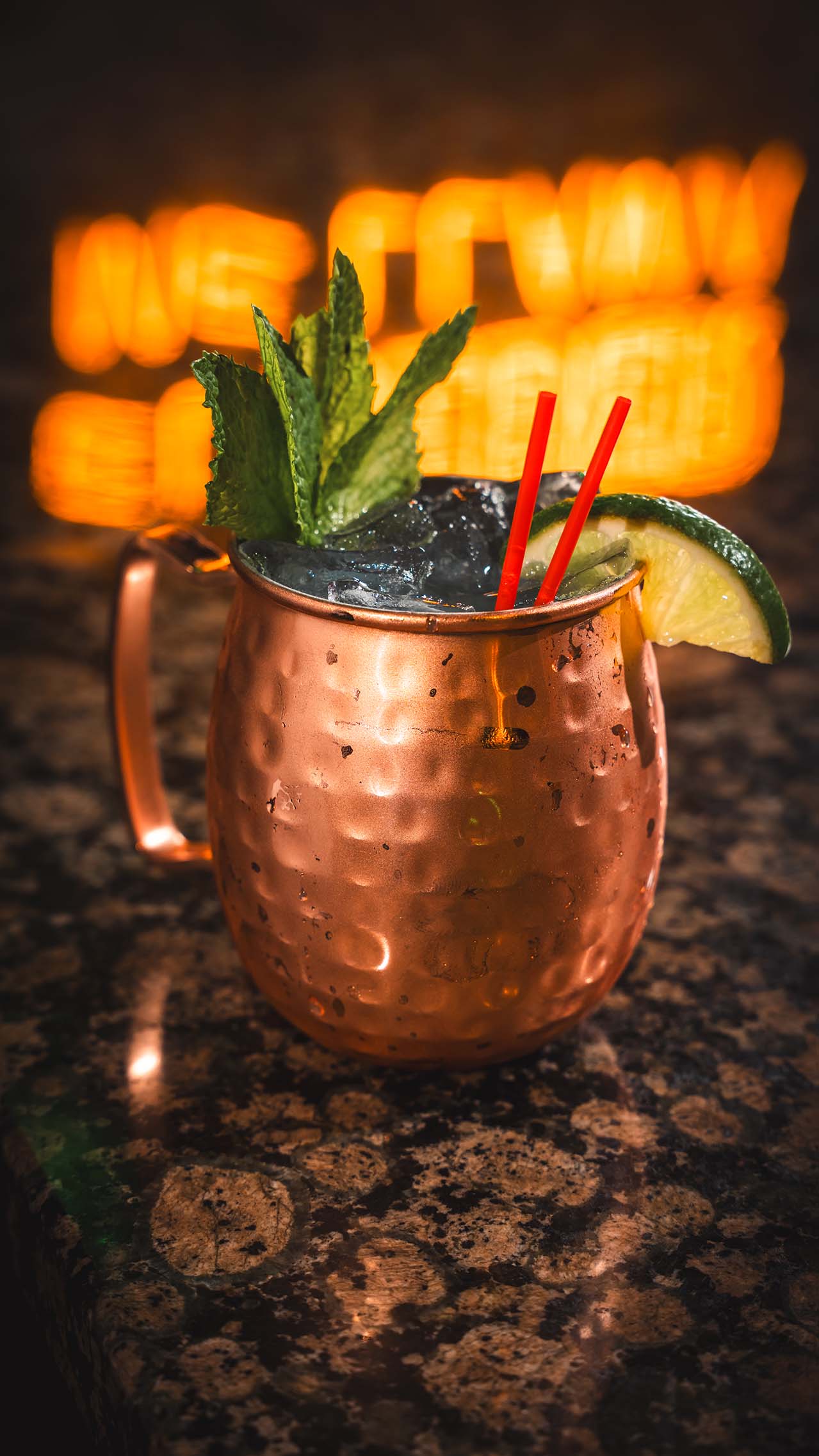 Copper mug cocktail with mint, lime, and crushed ice.